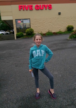 IN FRONT OF FIVE GUYS