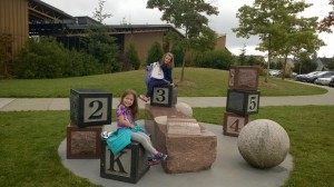 Camryn & Hayden on the blocks outside the school