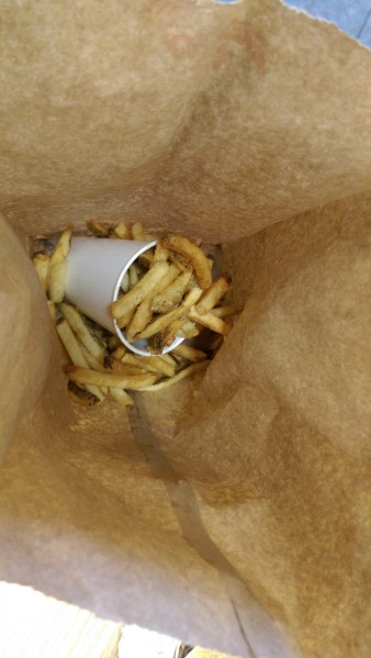 overflowing bag of fries